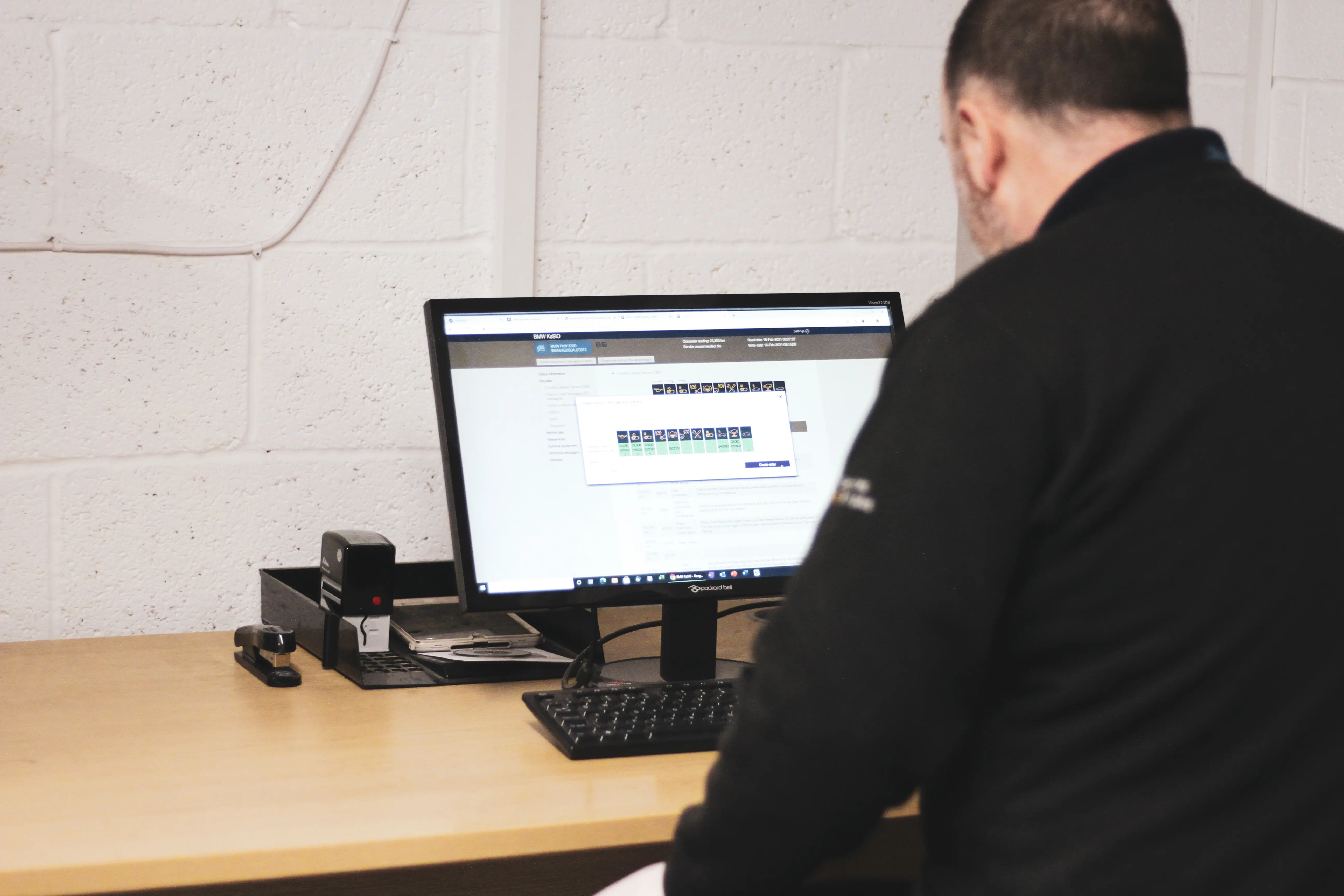 Technician running BMW diagnostics at Dack